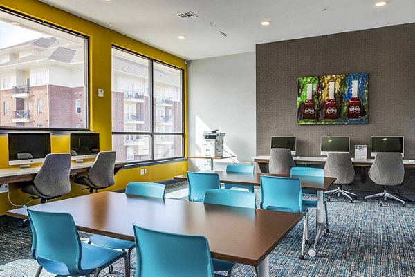 Study area with modern desks and comfortable seating at College View Apartments, a Greystar luxury community