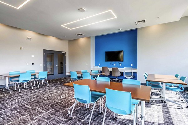 Study space with individual desks and modern lighting at College View Apartments