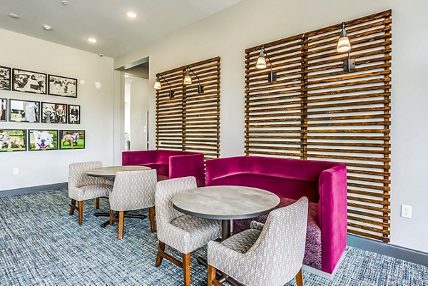 Study area with modern seating and individual workstations at College View Apartments, perfect for students seeking a focused learning environment