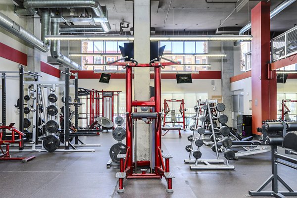 fitness center at The District on Apache Apartments