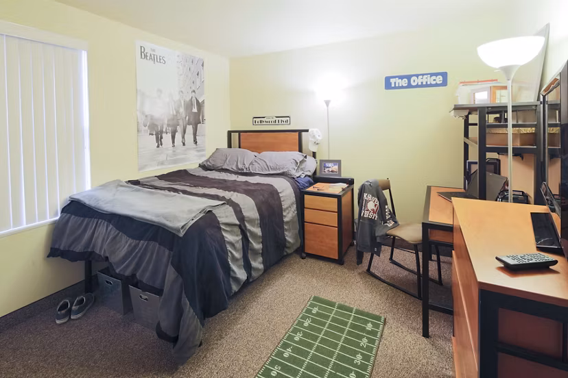Bright bedroom with large windows and modern decor at Evergreen Commons Apartments, a Greystar luxury apartment offering comfort and style