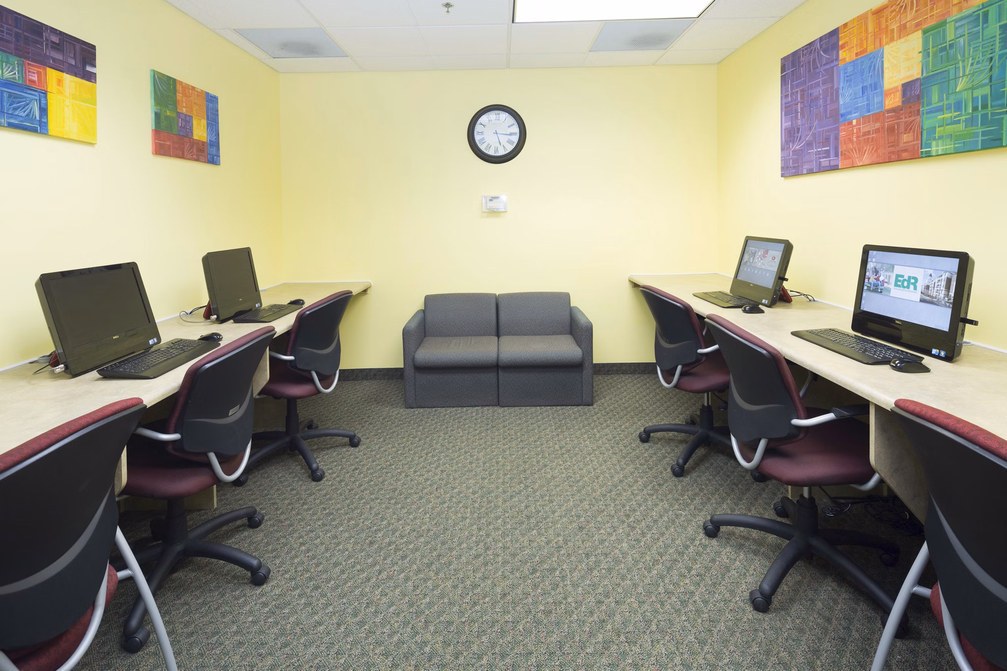 Business center featuring modern workstations at Evergreen Commons Apartments