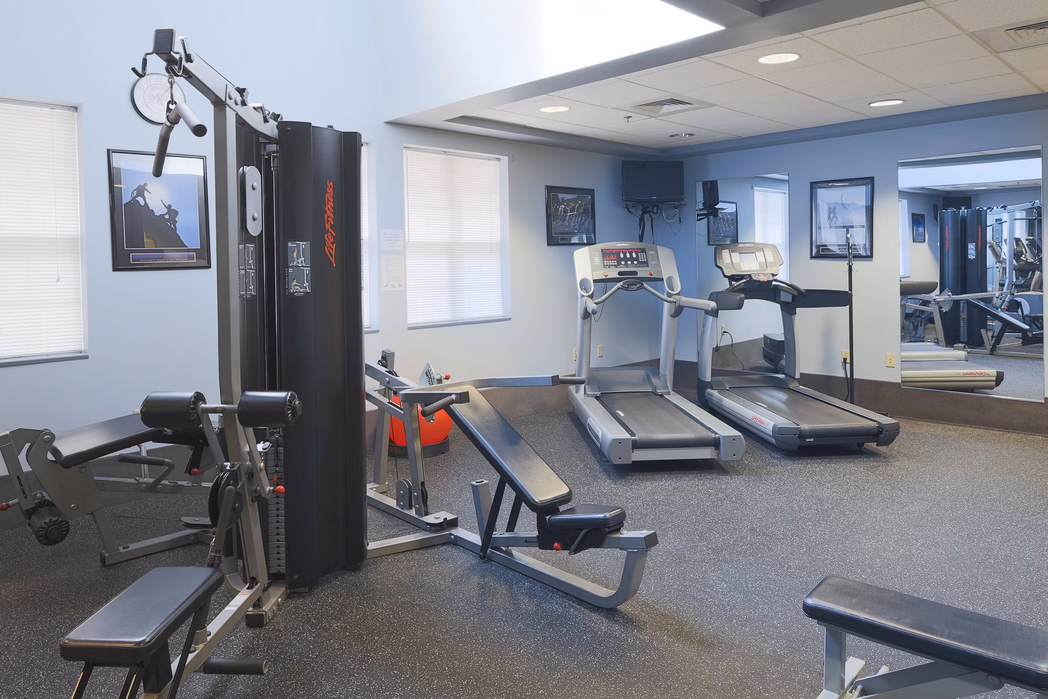 Modern fitness center with state-of-the-art equipment at Evergreen Commons Apartments