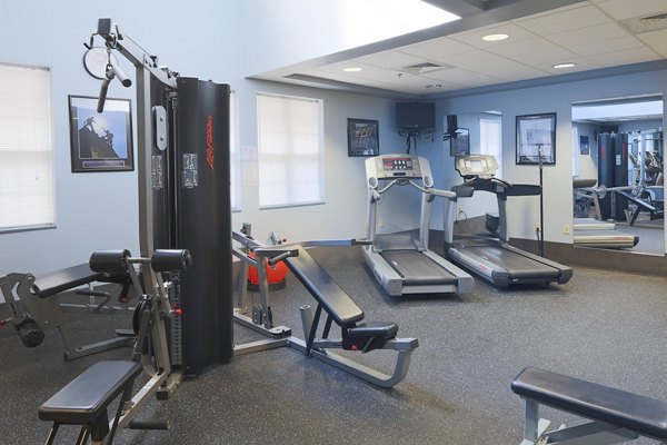 Modern fitness center with state-of-the-art equipment at Evergreen Commons Apartments