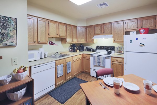 Modern kitchen featuring stainless steel appliances at Evergreen Commons Apartments