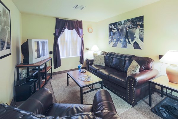 Living room with modern decor and natural light at Evergreen Commons Apartments