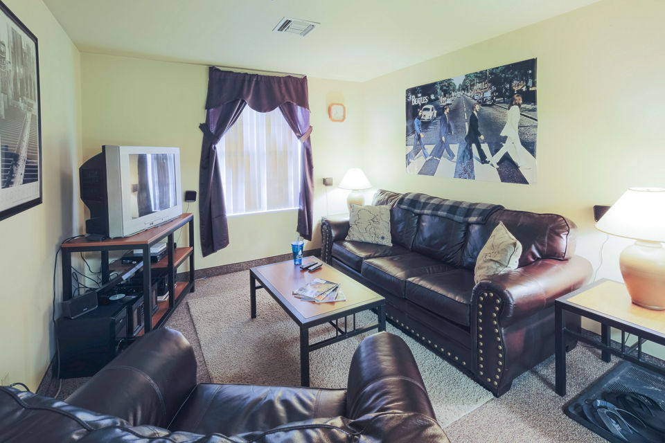 Living room with modern decor and natural light at Evergreen Commons Apartments