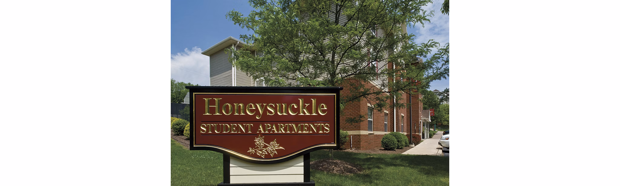 Honeysuckle Student Apartments: Modern signage at luxury student living community