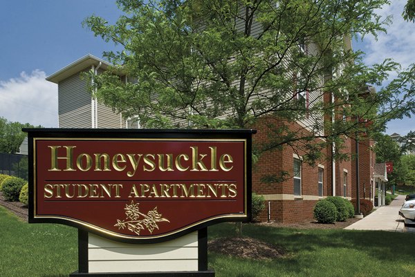 Honeysuckle Student Apartments: Modern signage at luxury student living community