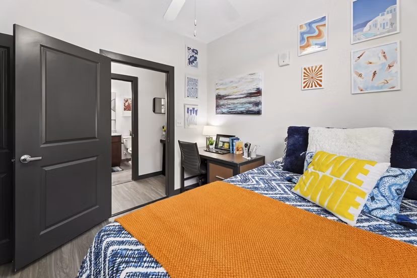 Spacious bedroom with modern decor at The Local Downtown Apartments