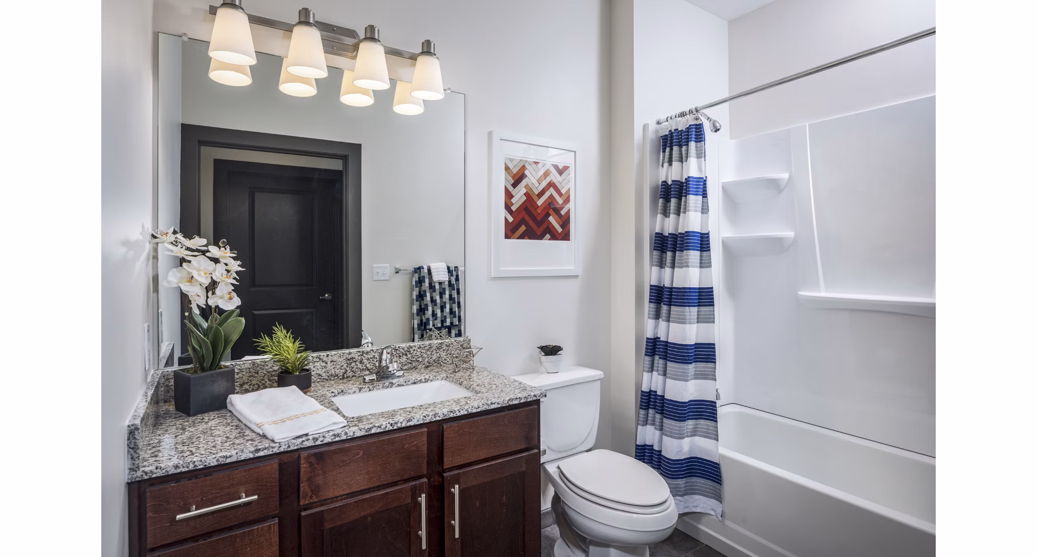 Modern bathroom with sleek fixtures at The Local Downtown Apartments