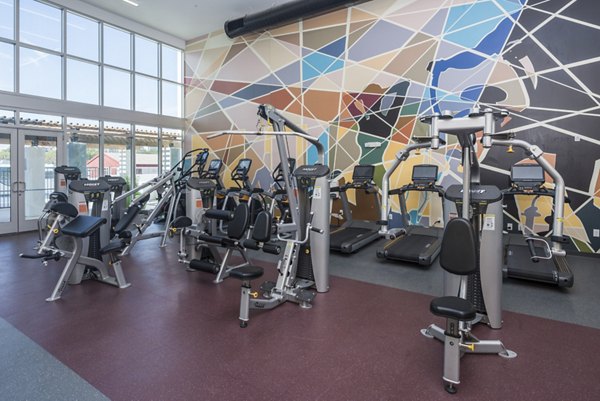 Fitness center with advanced equipment at The Local Downtown Apartments