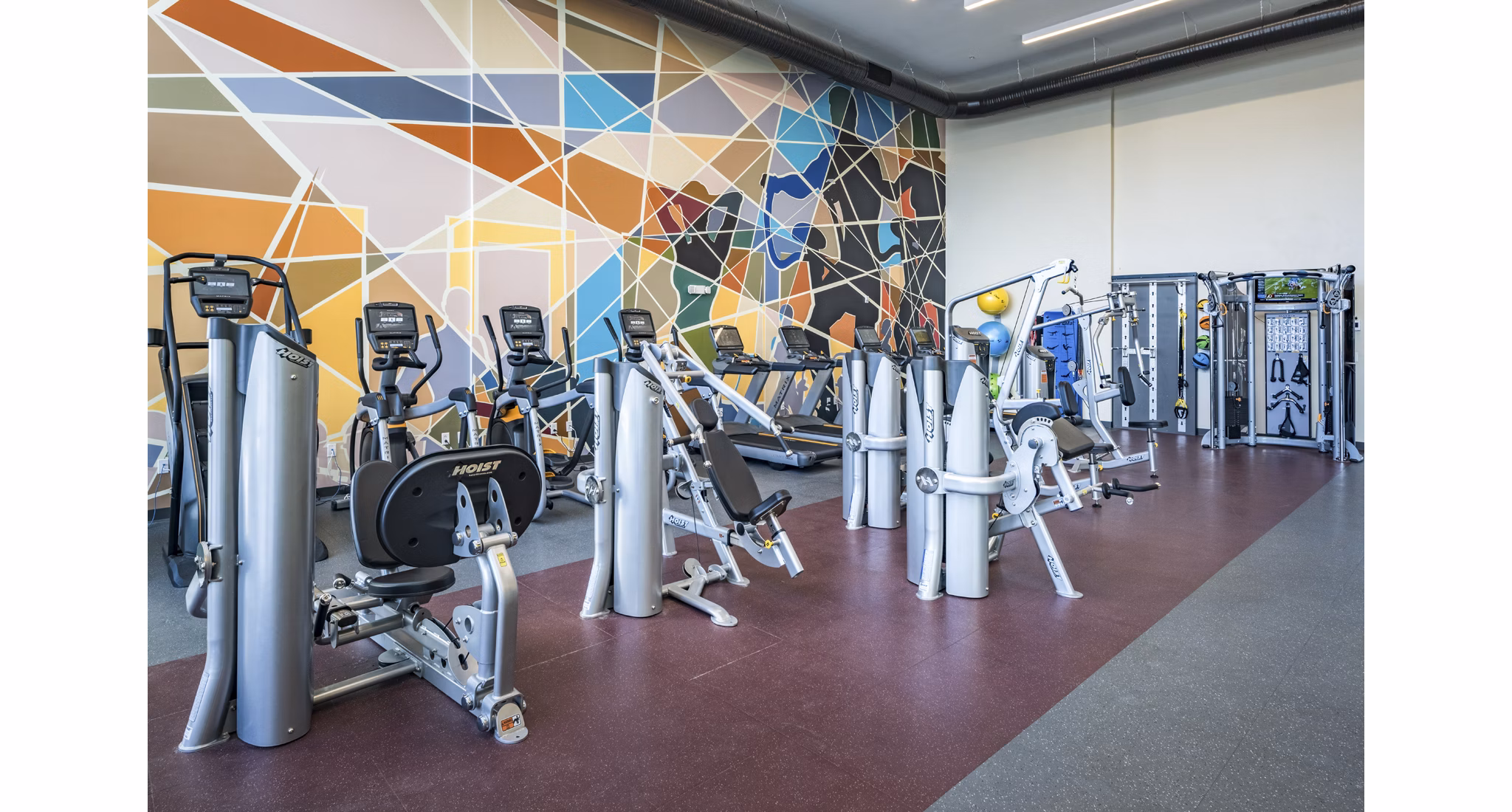 State-of-the-art fitness center with modern equipment at The Local Downtown Apartments