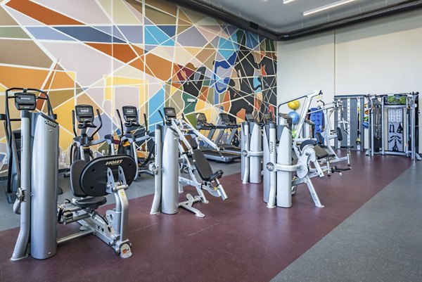State-of-the-art fitness center with modern equipment at The Local Downtown Apartments