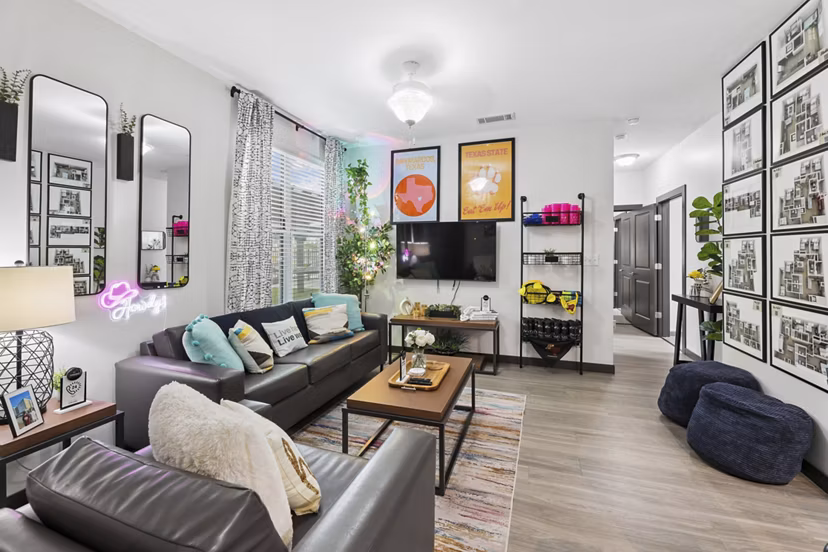Cozy living room with modern furnishings in The Local Downtown Apartments, offering a luxurious urban living experience