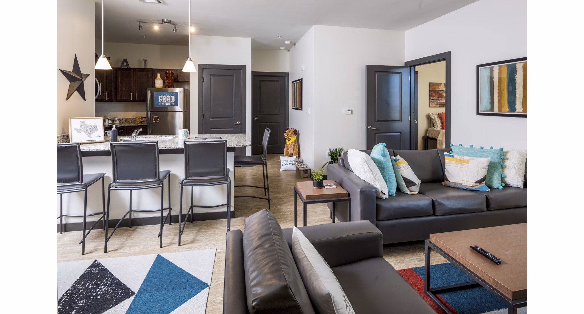 Cozy living room with modern furnishings in The Local Downtown Apartments, offering a luxurious urban living experience