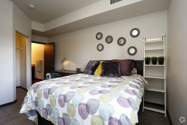 Modern bedroom with sleek furnishings and large windows at Lokal Apartments featuring luxury design