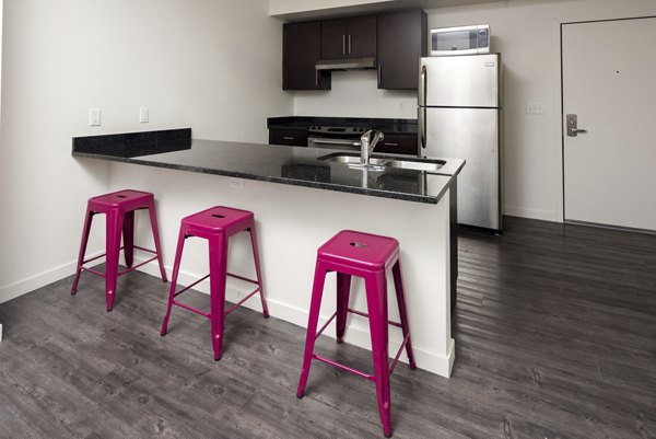 Modern kitchen featuring stainless steel appliances in Lokal Apartments