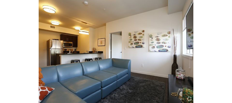 Spacious living room with modern decor in Lokal Apartments, showcasing luxury interiors and comfort