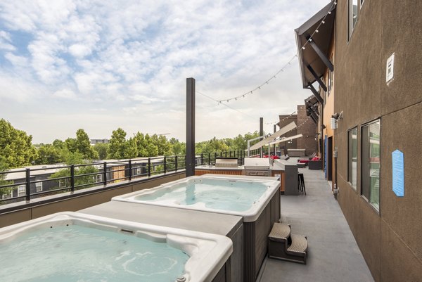 Luxurious rooftop hot tub at Lokal Apartments offering relaxation with city views