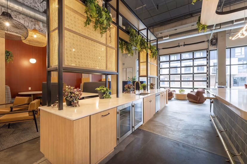 Modern clubhouse with cozy seating and billiards at The Marshall Apartments, ideal for socializing and relaxation