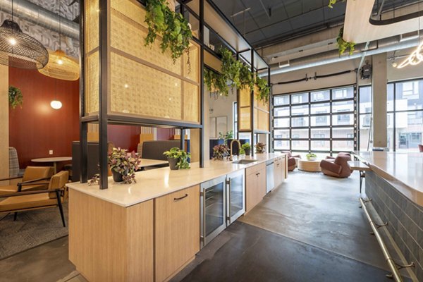 Modern clubhouse with cozy seating and billiards at The Marshall Apartments, ideal for socializing and relaxation