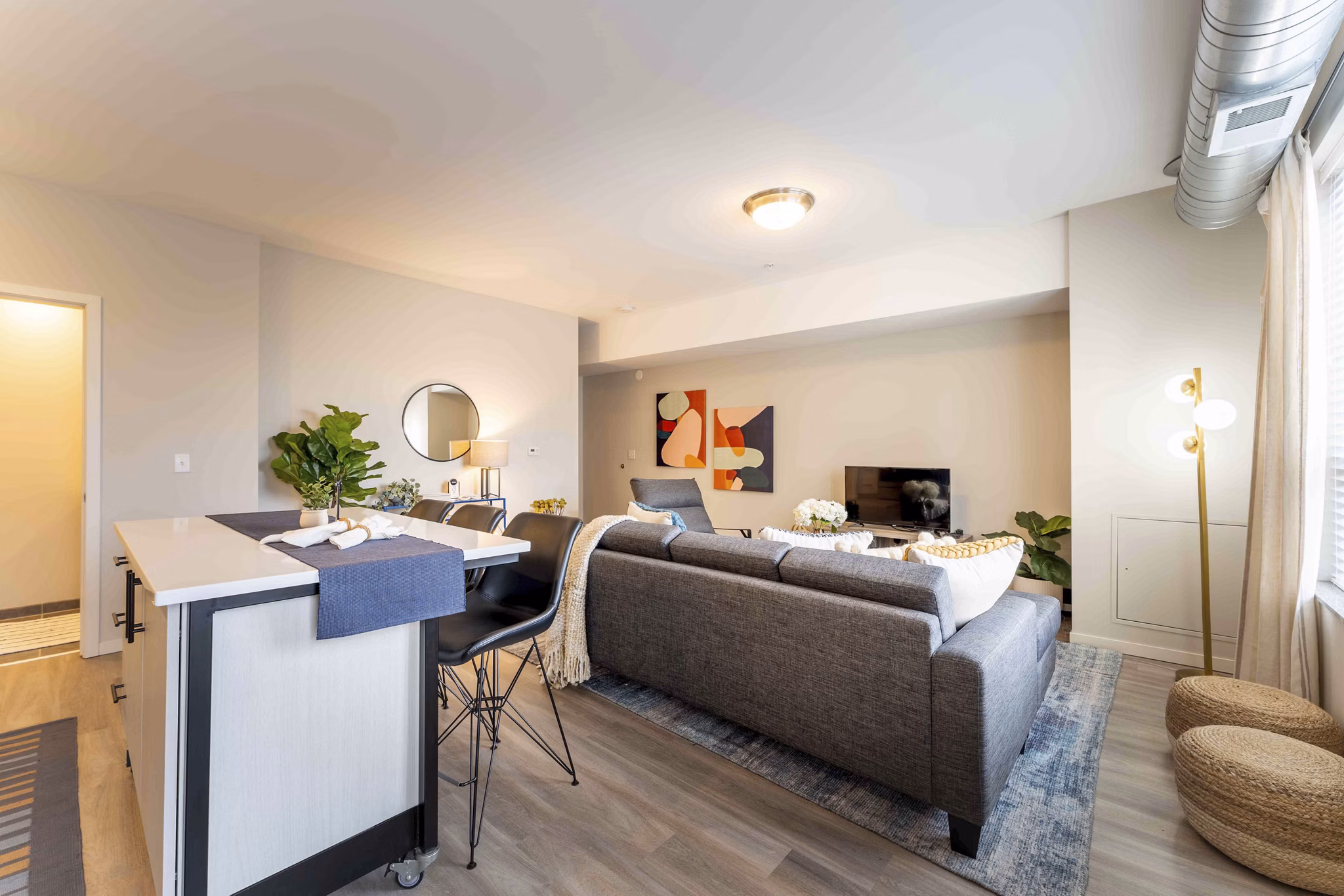 Cozy bedroom with modern furnishings in The Marshall Apartments
