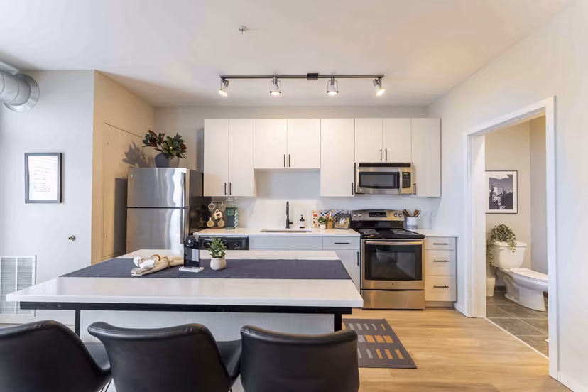 Sleek kitchen with modern appliances at The Marshall Apartments in luxury Greystar community