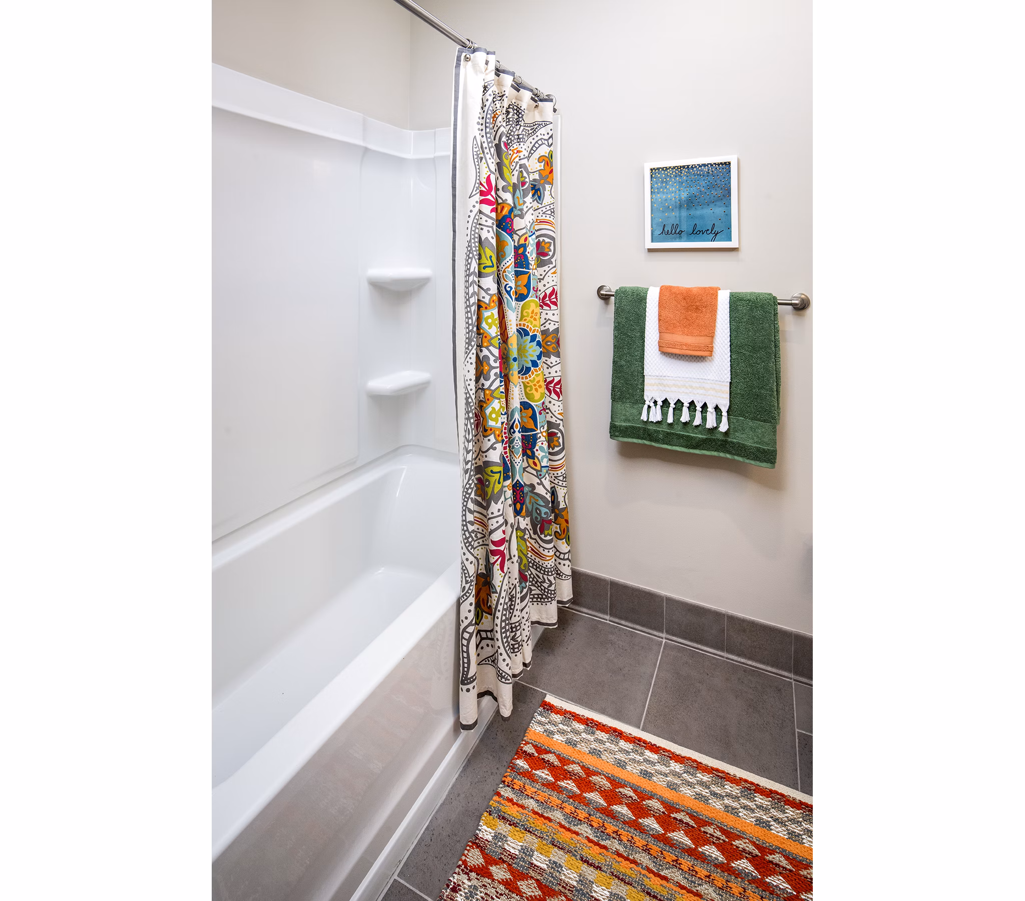 Modern bathroom featuring sleek fixtures and ample storage space at SkyVue Apartments