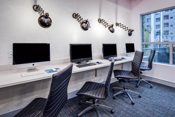 State-of-the-art business center at SkyVue Apartments with modern workspaces and high-speed internet access