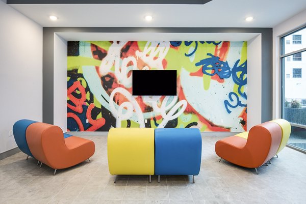 Clubhouse lobby with modern furnishings at SkyVue Apartments offering luxury Greystar living