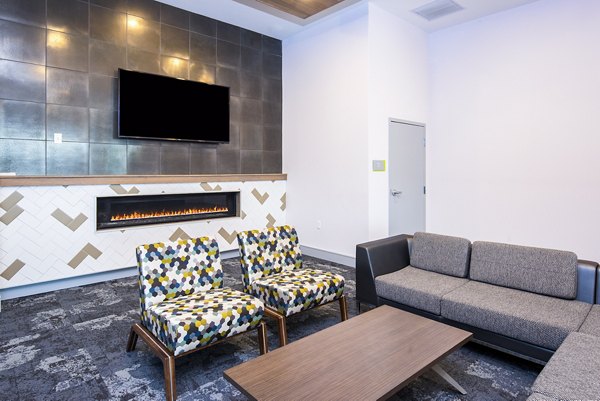 Modern clubhouse lobby with elegant seating and lighting at SkyVue Apartments