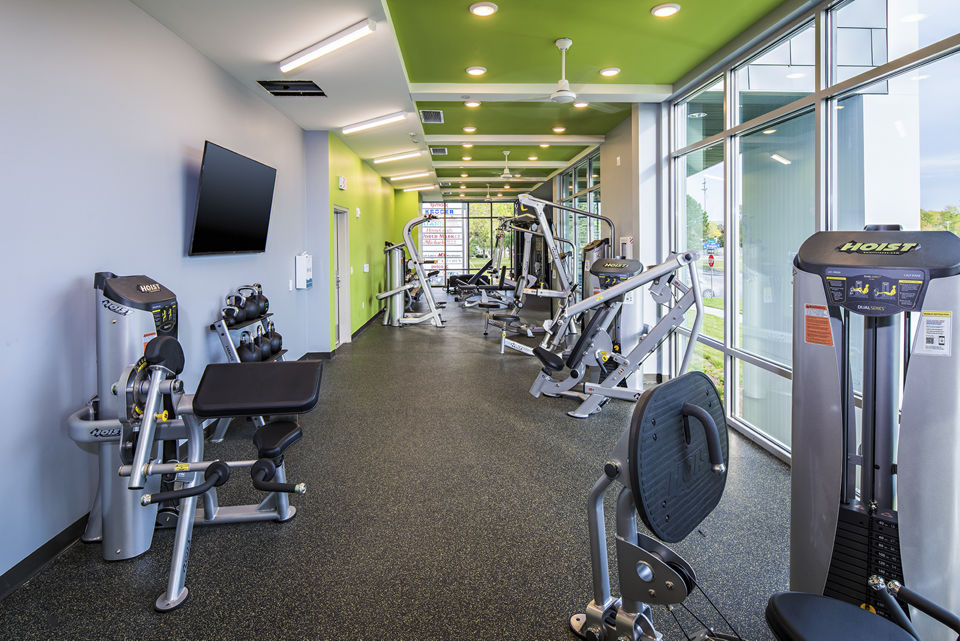Fitness center with modern equipment at SkyVue Apartments offering luxury amenities for residents