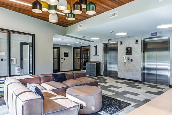 Contemporary clubhouse with modern seating at Southside Commons Apartments, perfect for gatherings and social events