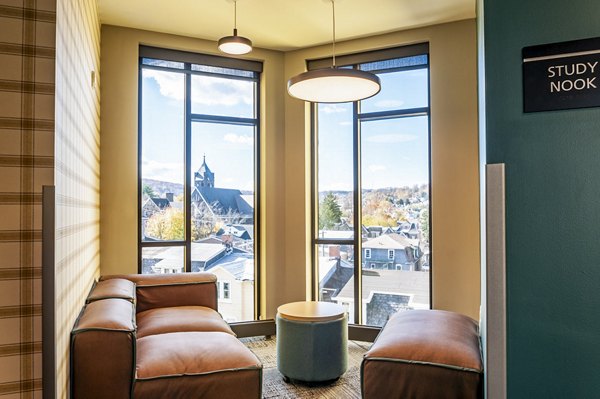 Clubhouse study area with modern furnishings at Southside Commons Apartments, ideal for focused work and social gatherings