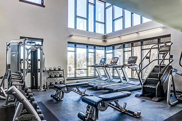 Fully equipped fitness center at Southside Commons Apartments offers modern workout facilities