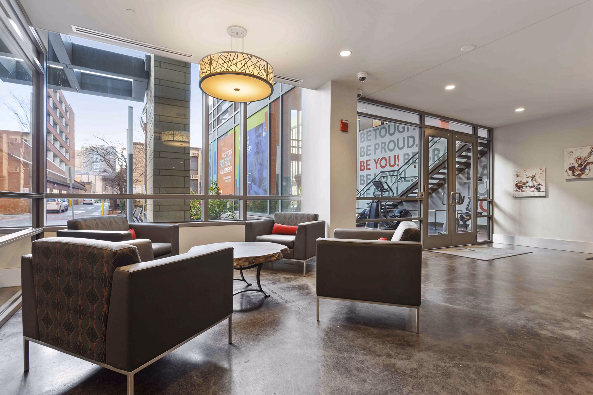 Contemporary clubhouse at The Varsity Apartments featuring lounge seating and games