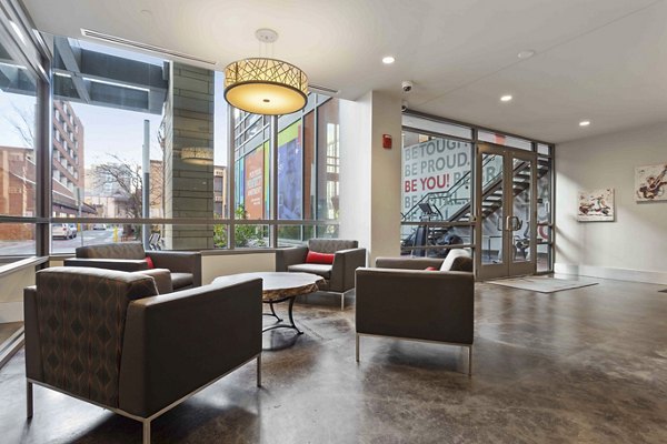 Contemporary clubhouse at The Varsity Apartments featuring lounge seating and games