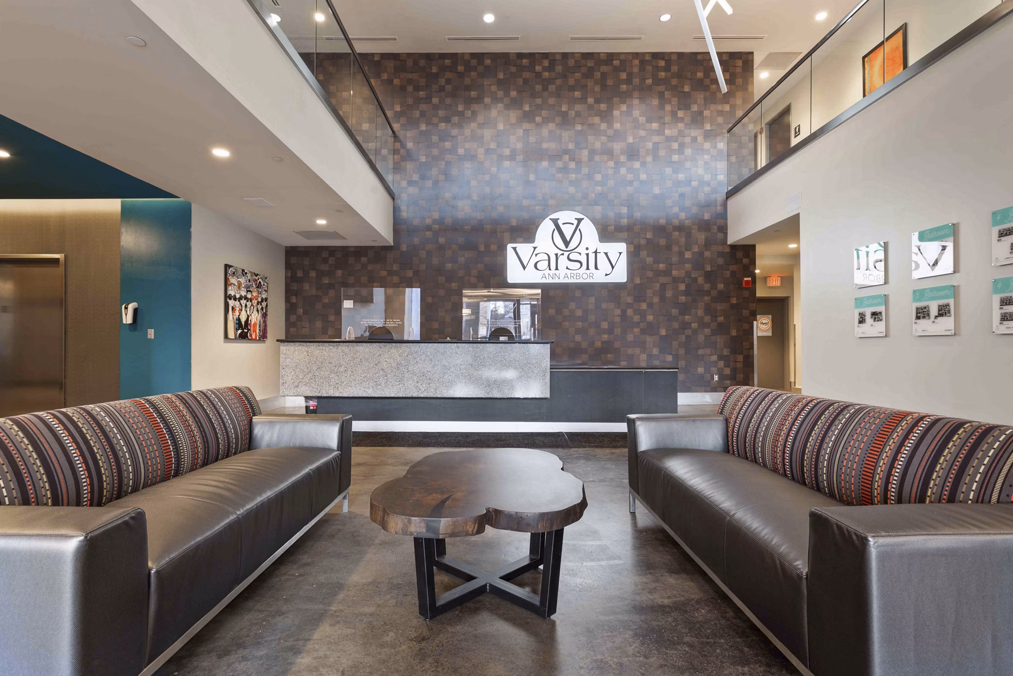 Contemporary clubhouse with lounge seating and decor at The Varsity Apartments, ideal for social gatherings and relaxing