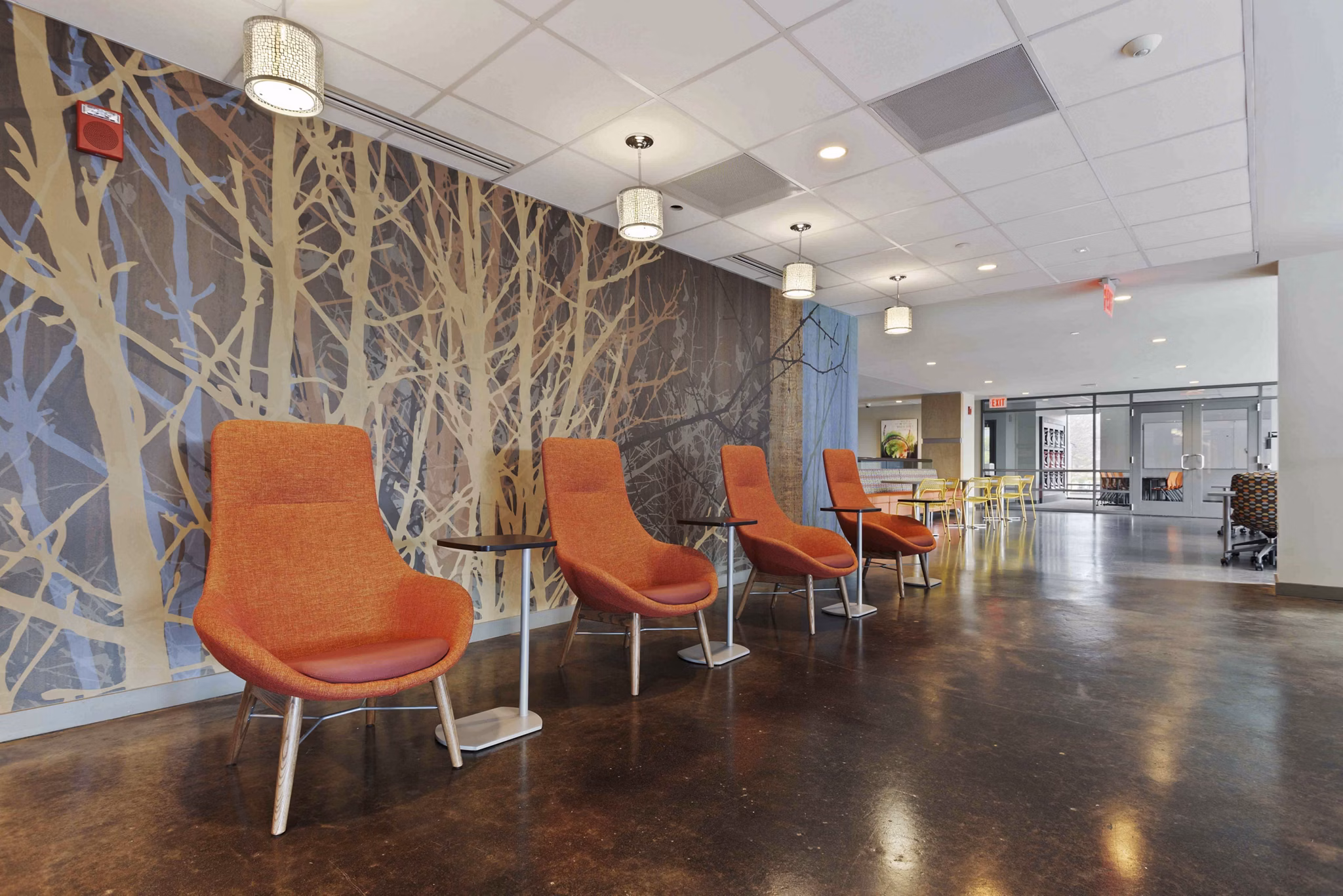 Elegant clubhouse with modern furnishings at The Varsity Apartments, offering luxury living spaces in a vibrant community