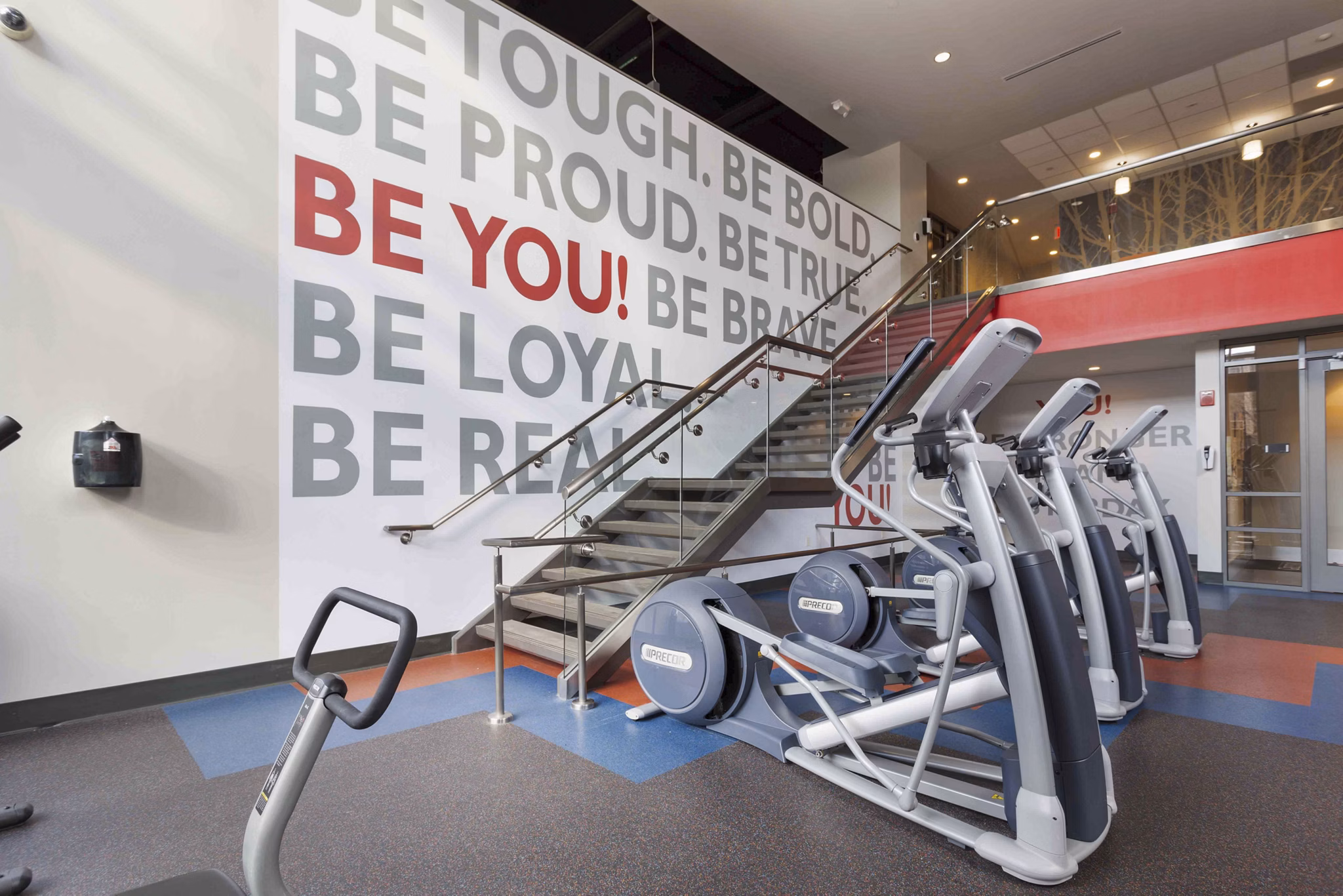State-of-the-art fitness center featuring modern equipment at The Varsity Apartments