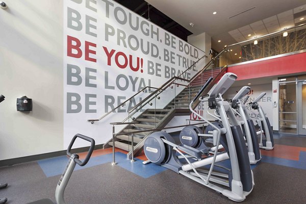 State-of-the-art fitness center featuring modern equipment at The Varsity Apartments