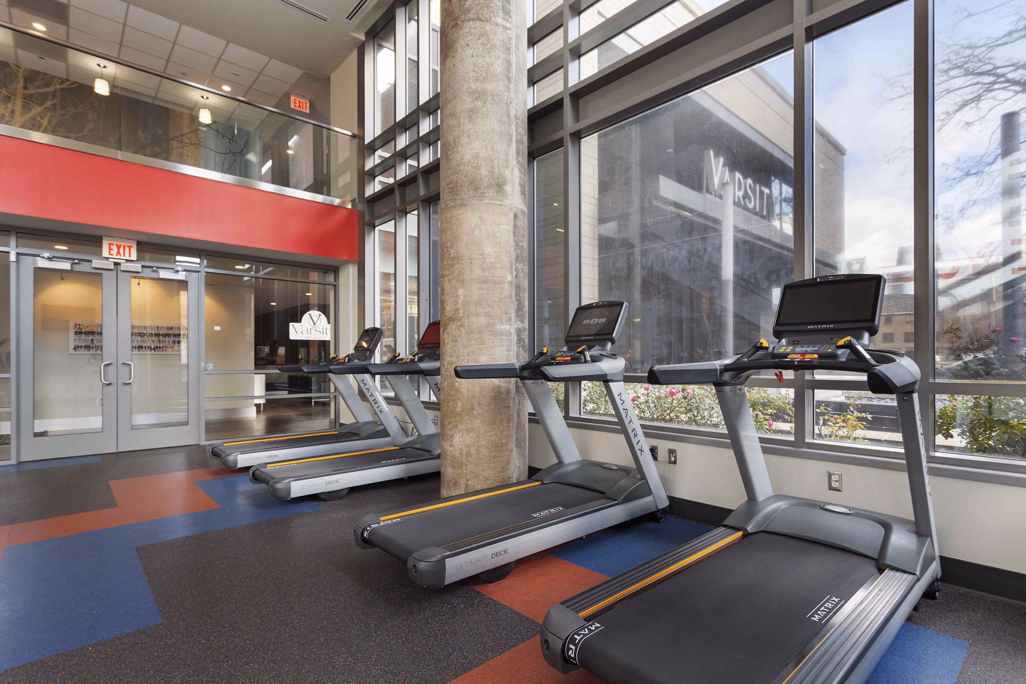 Modern fitness center with state-of-the-art equipment at The Varsity Apartments