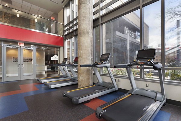 Modern fitness center with state-of-the-art equipment at The Varsity Apartments