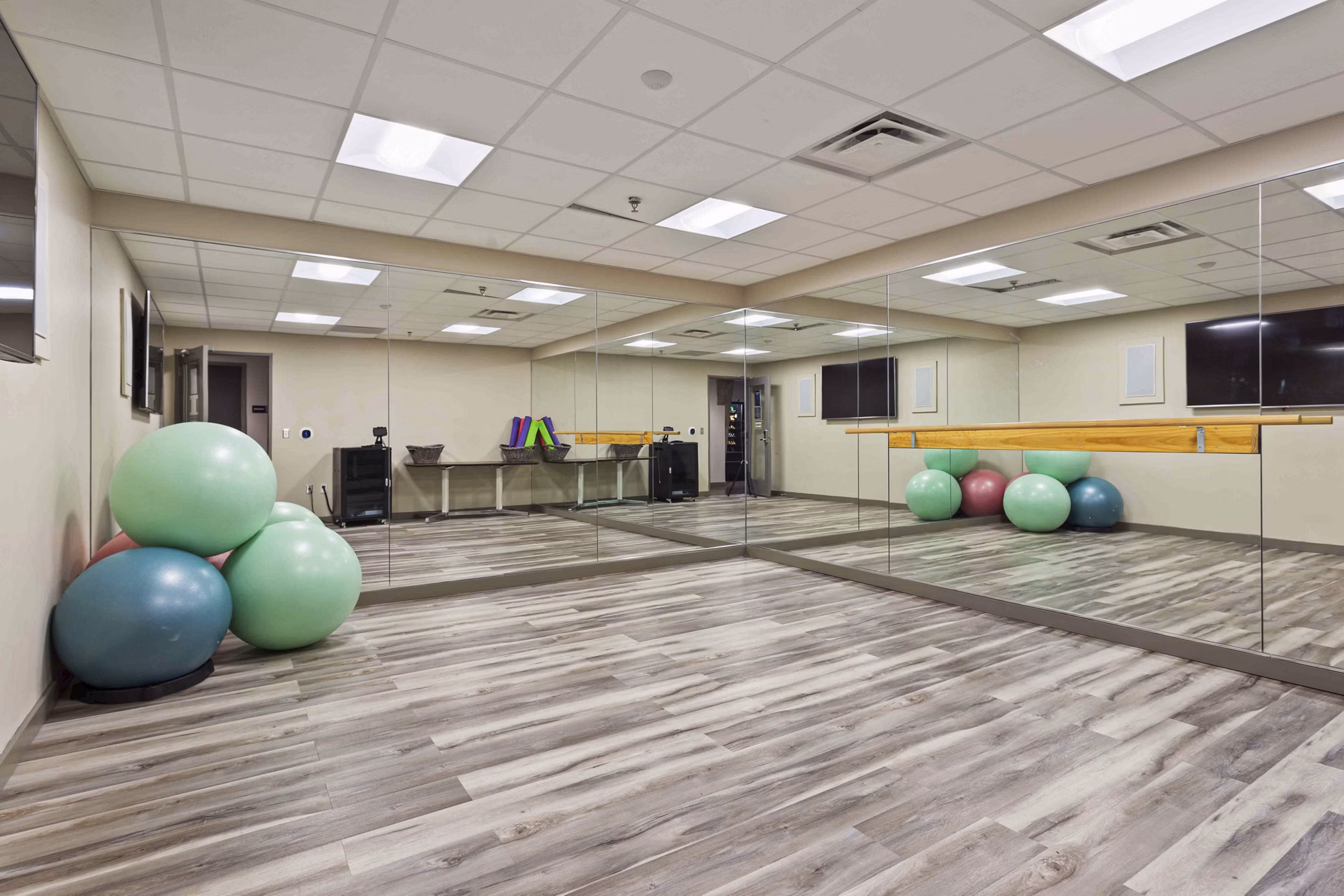 Yoga and spin studio with modern equipment at The Varsity Apartments, ideal for fitness enthusiasts seeking an active lifestyle
