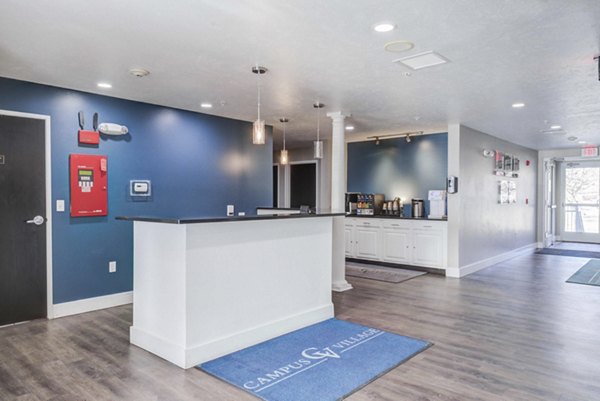 Clubhouse featuring modern design and cozy seating at Campus Village apartments in East Lansing
