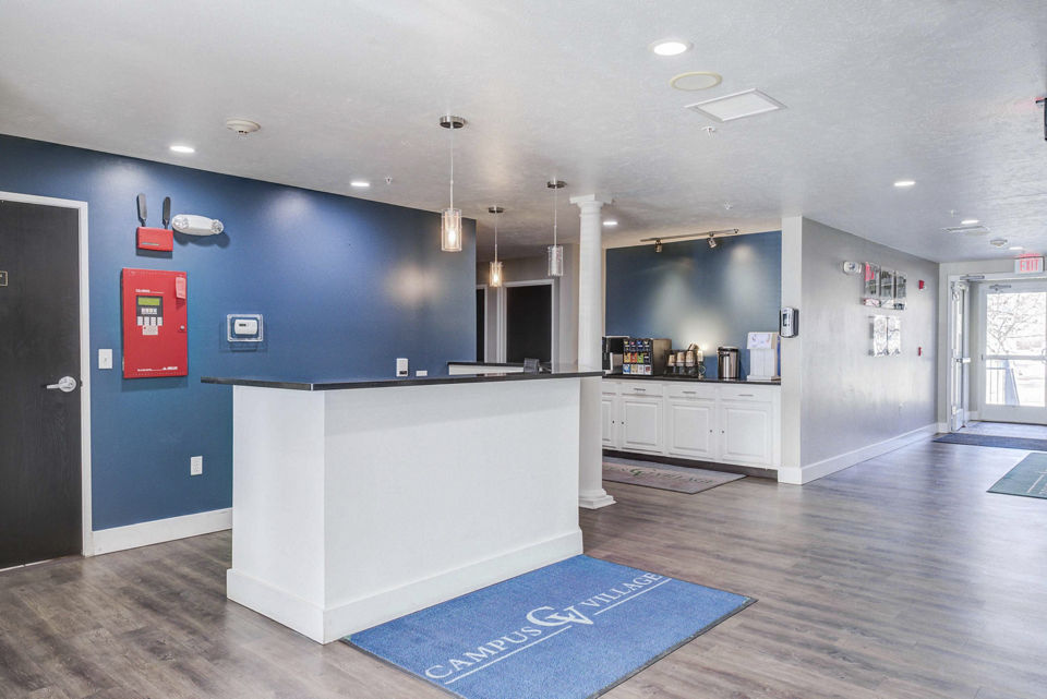 Clubhouse featuring modern design and cozy seating at Campus Village apartments in East Lansing