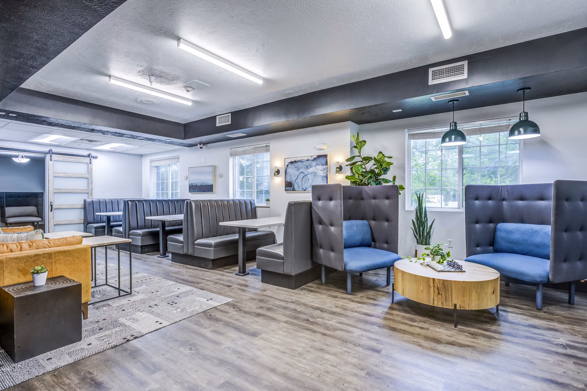 Clubhouse study area with modern design at Campus Village - E Lansing Apartments for students