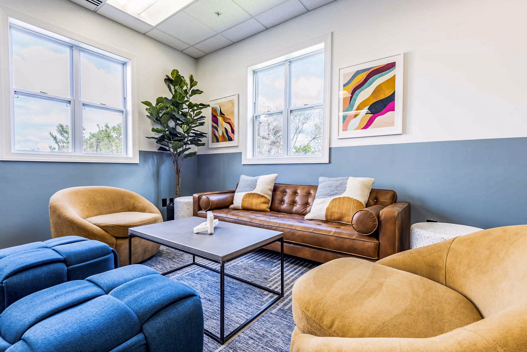 Elegant clubhouse featuring modern decor and communal spaces at University Village Apartments on Colvin