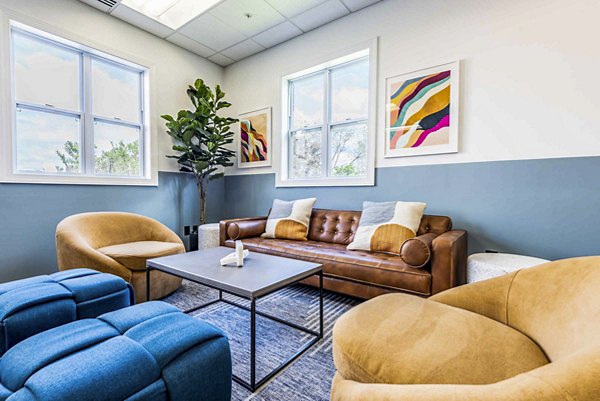 Elegant clubhouse featuring modern decor and communal spaces at University Village Apartments on Colvin